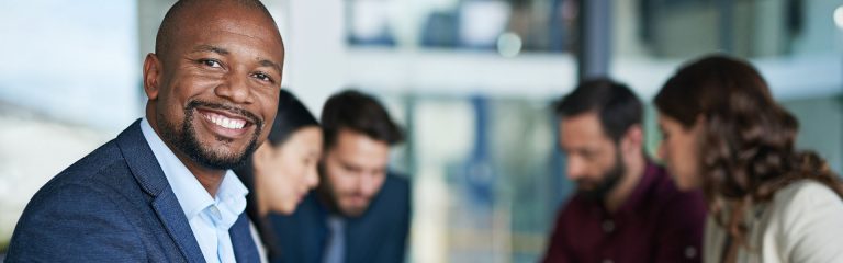 Cropped portrait of a businessman sitting in a meeting